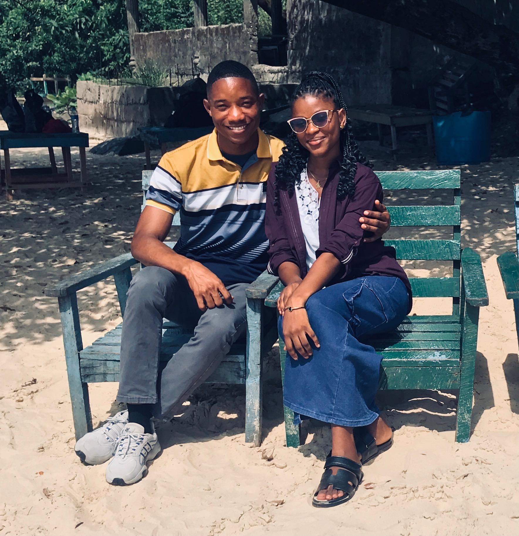 Simeon and Benrina sitting together on a bench